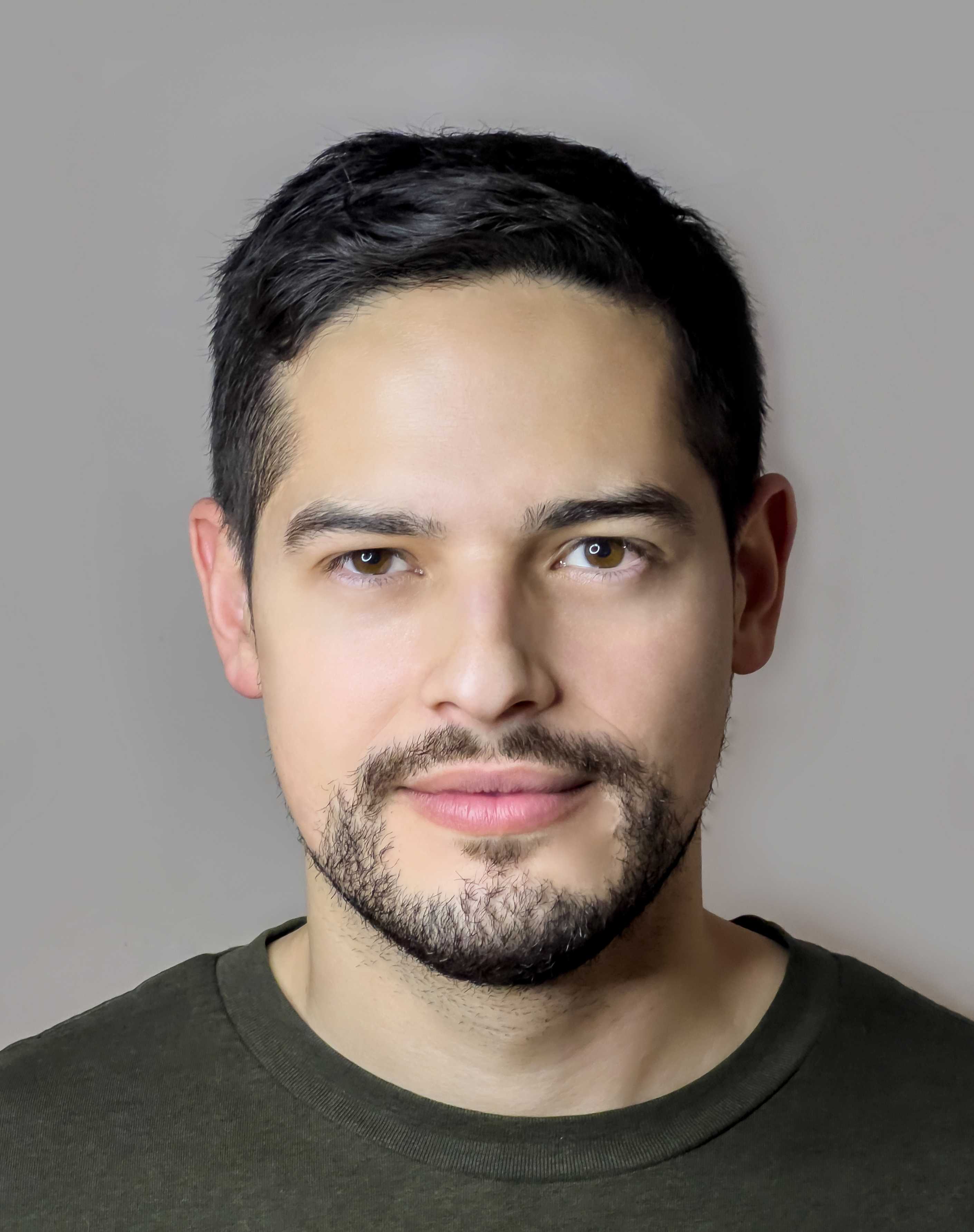 Carlos J Hernandez, a man of age 33, brown eyes, and brown hair.